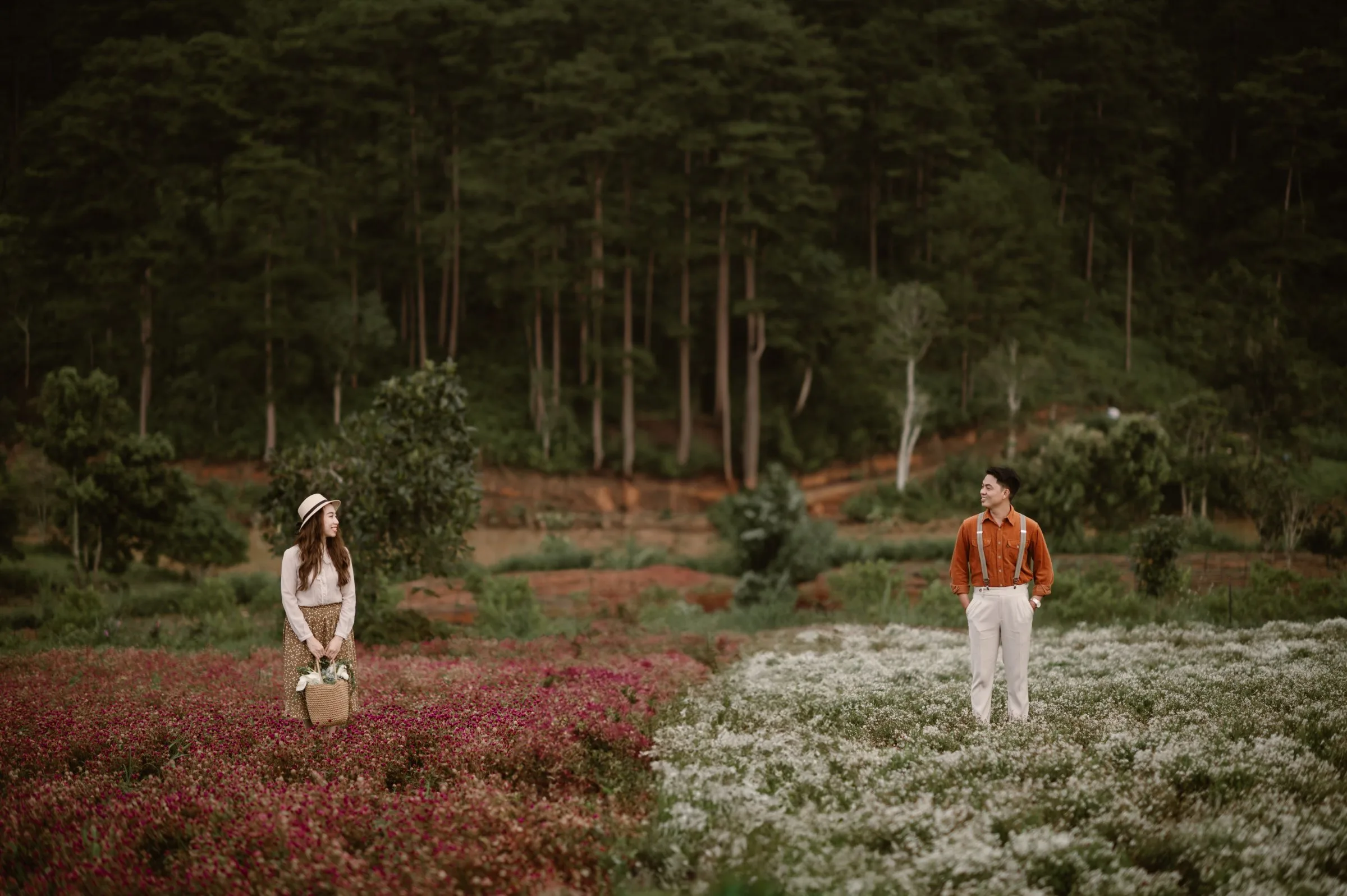 A couple in a blooming Da Lat flower field
