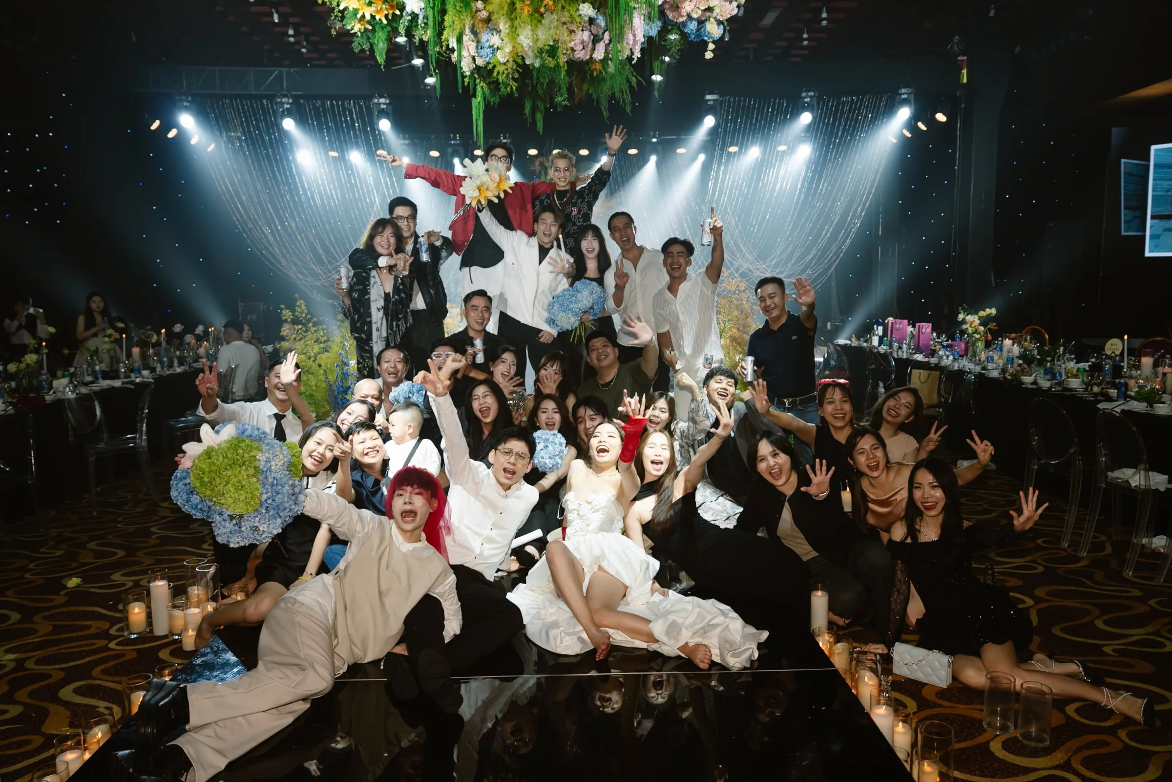 Bride, groom and friends celebrating at a Da Nang wedding party