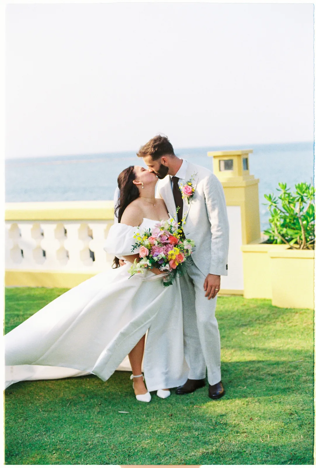 Newlyweds by the sea at Victoria Hoi An Beach Resort, on 35mm film