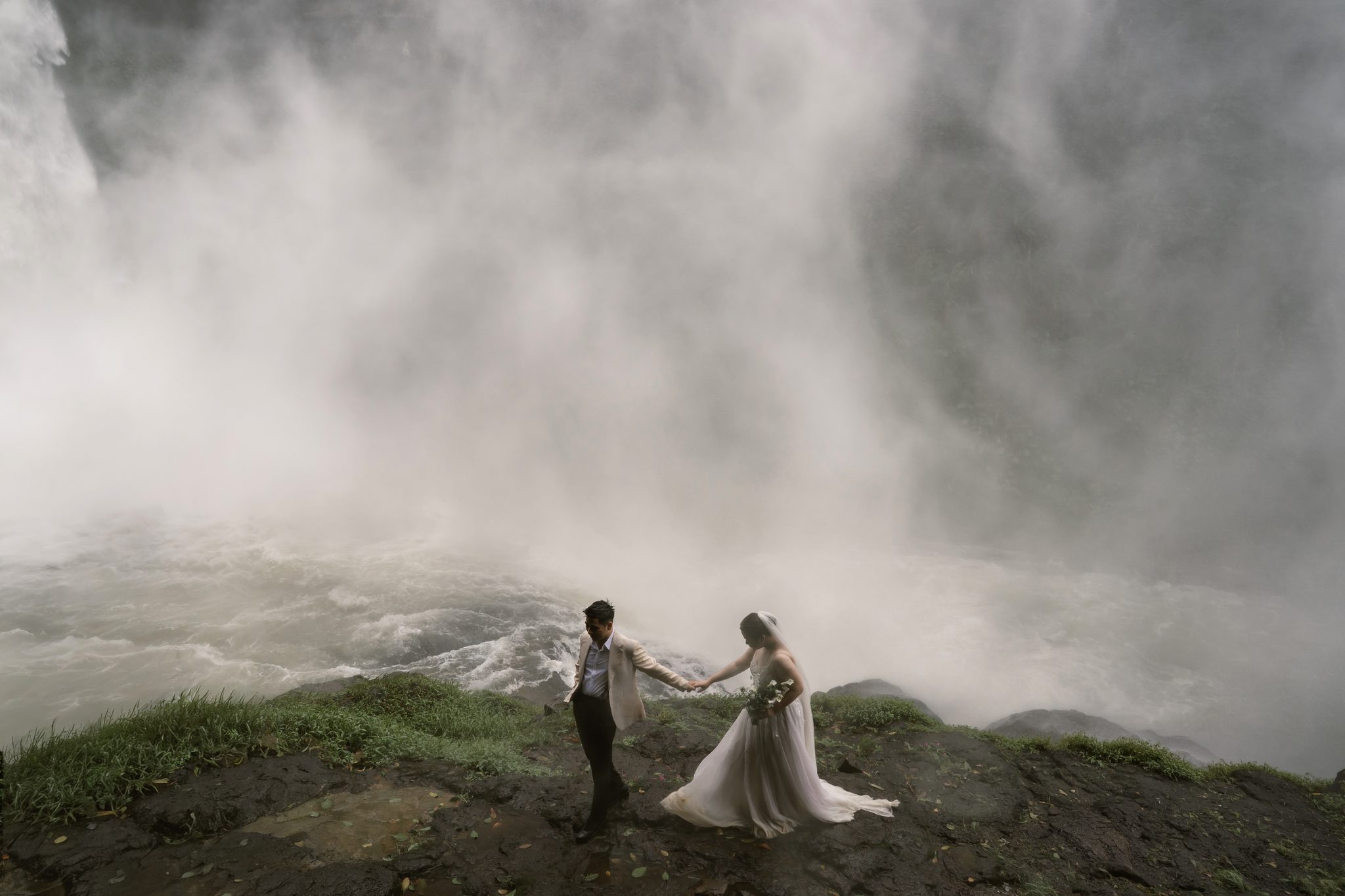 A misty cliff-top moment near Dambri Waterfall, Da Lat