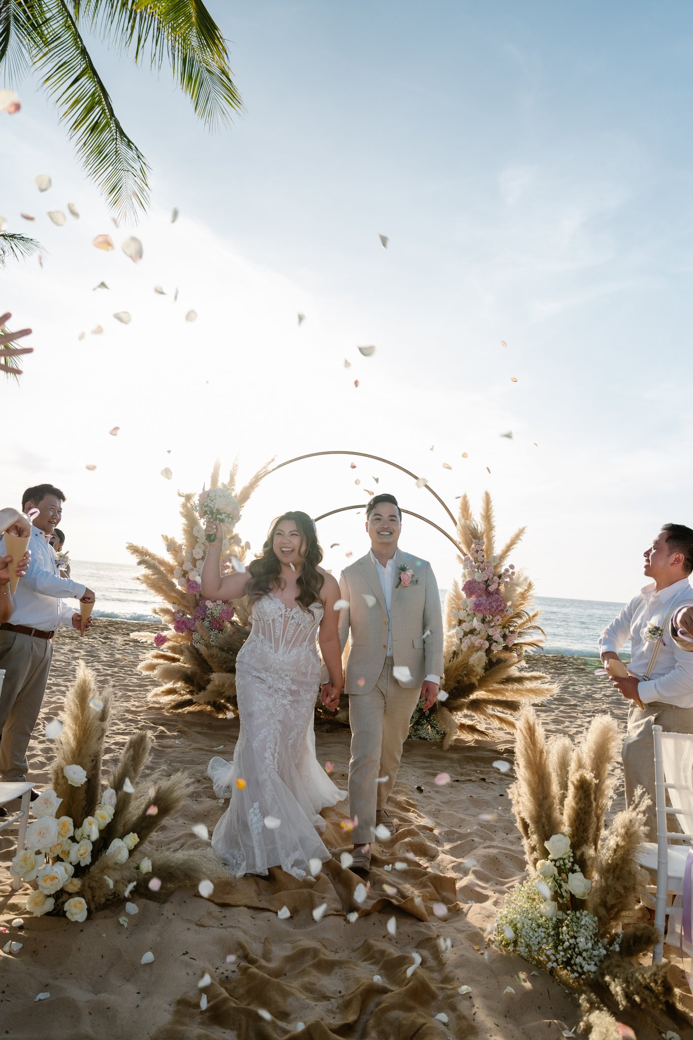 Confetti recessional after a beach wedding ceremony on Phu Quoc island